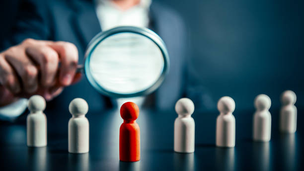 Magnifying success powerful red wooden businessman leading way. Human resource empowering corporate strategic teamwork unlock potential find perfect fit HR employment discovering unique talent concept